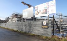 the praz-dagoud campus in the early stages of constructions with scaffolding surrounding a concrete structure.