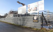 the praz-dagoud campus in the early stages of constructions with scaffolding surrounding a concrete structure.