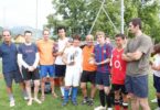 a photo of the students vs staff football game
