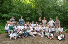 a dated photo from 2008 showing primary students in the forest